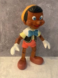 lot 13 image: Disney Wooden Numbered Pinocchio Figurine