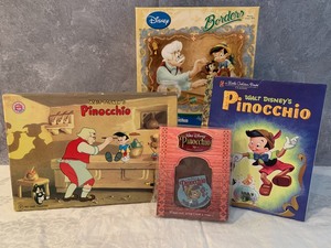 lot 10 image: Pinocchio Puzzle, Two Stamping Kits and Book