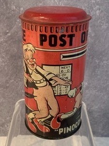 lot 7 image: Vintage Pinocchio Post Office Round Tin Bank