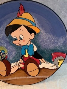 lot 1 image: Pinocchio Signed and Numbered Charger by Elisabete Gomes