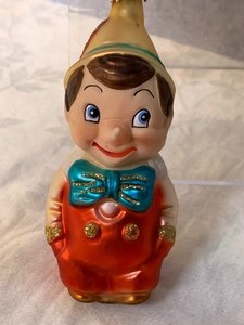 lot 81 image: Three Adorable Pinocchio Ornaments