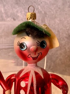 lot 78 image: Two Whimsical Pinocchio Figurine Ornaments