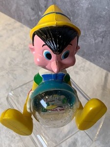 lot 65 image: Vintage Plastic Pinocchio Snow Globe Figurine