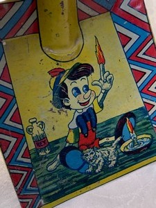 lot 67 image: 1939 Tin Lithograph Pinocchio Toy Sand Shovel
