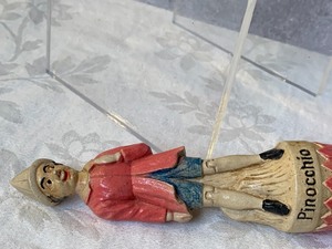 lot 63 image: Vintage Pinocchio Pencil Sharpener and Whisk Broom
