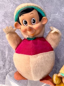 lot 62 image: 1950s Gund Pinocchio Plush Toy and Gunderful Roly Poly Pinocchio Figurine