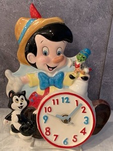 lot 59 image: Collectible Schmid Pinnochio Figurines and Schmid Pinocchio Wall Clock