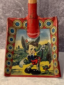 lot 61 image: 1939 Tin Lithograph Pinocchio Toy Sand Shovel