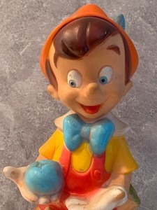 lot 43 image: Three Vintage Rubber Pinocchio Figurines