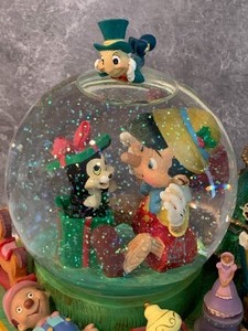 lot 86 image: Pinocchio Musical Snow Globe