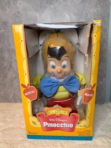 lot 97 image: Walt Disneys Animated Singing Pinocchio Figurine in Package
