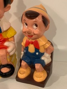 lot 157 image: Two Vintage Hard Plastic Pinocchio Banks