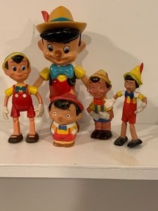 lot 149 image: Five Rubber of Vinyl Pinocchio Figurines