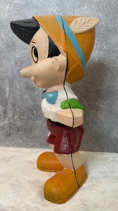 lot 100 image: Cast Iron Painted Pinocchio Bank