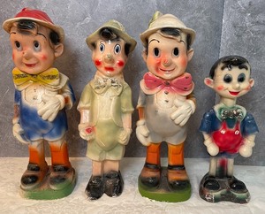 lot 111 image: Four Vintage Pinocchio Chalkware Figurines
