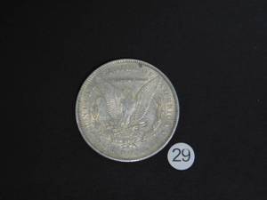 lot 29 image: 1885 AU Morgan Silver Dollar