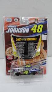 lot 51 image: 2007 Jimmie Johnson #48 Schedule Diecast car & Magnet