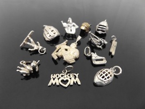 lot 98 image: 12 Vintage .925 Sterling Silver Sports Themed Charms
