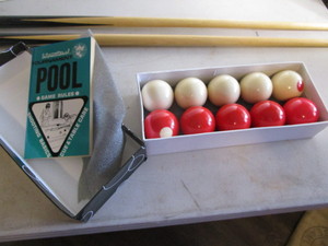 Bumper pool cues & set of balls...