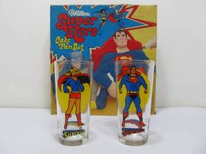 lot 129 image: 2 Vintage Superman & Super Girl Collectors Glasses & Vintage Wilton Superhero Cake Pan Set