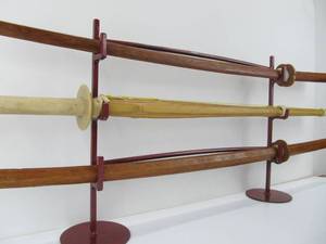 lot 133 image: Lot of 3 Wooden Training Swords wIron Rack