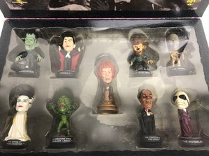 lot 312 image: New in Box FAO Schwarz Universal Studios MONSTERS Little Big Head Figure Set