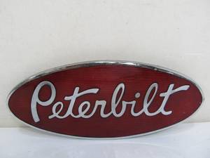 lot 247 image: Large Enameled Metal PETERBILT Semi Truck Emblem