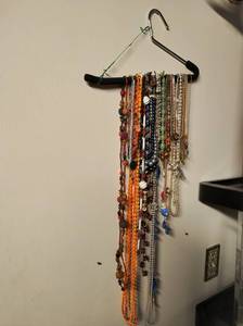 Hanger filled with Necklaces & Bolo Tie