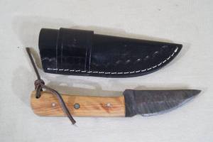 lot 63 image: Unused Hunting Knife - Walnut Handle, Damascus Style Blade