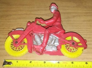 lot 41 image: Auburn Rubber Motorcycle and Rider.