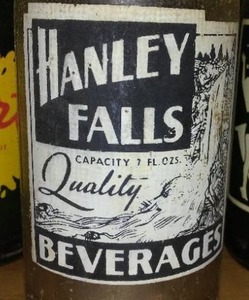 lot 192 image: Hanley Falls Beverage Bottle. Squirt, 7-Up, Sun-Rise, Mountain Dew. Hanley Falls Bottling Co. MN