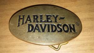 lot 254 image: 1983 Harley Davidson brass belt buckle.