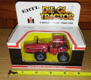 lot 735 image: ERTL IH 4 Wheel Drive Tractor, New in Box