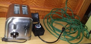 lot 786 image: 50 ft. Extension Cord, Cuisinart Toaster and timer.
