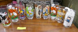 Group of 9 character glasses, Sylvester and Tweety, Daffy Duck, Spud the Bud light dog, Charlie Brown, Smurf, Road Runner, Muppets
