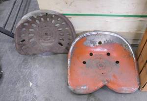 2 vintage steel tractor seats