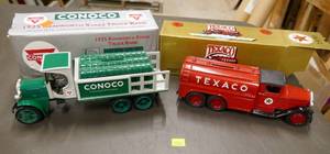 2 collectible Die-cast trucks Conoco truck with barrels of oil in the back and a Texaco tanker, both banks with keys on the undersides