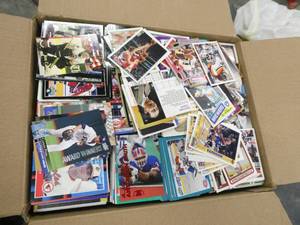 Large box full of Baseball, football, basketball Trading cards, a couple thousand cards