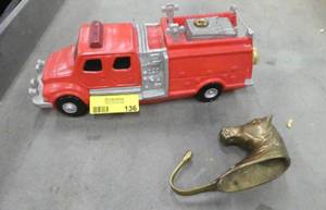 Cute fire engine lawn sprinkler and a brass horse coathat hanger