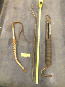 Riding whip, vintage scale and a unique pointer stick that is made from bullets welded together