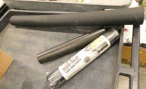 Rolls of tool box liner and larger 36 rubber mat for setting equipment on etc
