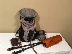 lot 273 image: REI Ultralite UL60 Filled with Gear & Pair of Hiking Poles