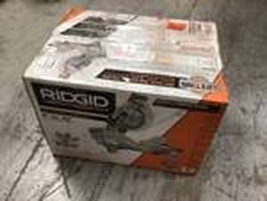 lot 103 image: 15 Amp 10 in. Dual Bevel Miter Saw with LED Cut Line Indicator by RIDGID Customer Returns See Pictures