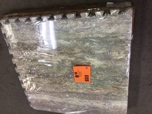 lot 21 image: TrafficMaster BrownTravertine 24 in. x 24 in. x 0.47 in. Wood All Purpose Flooring (4-Pack) Customer Returns See Pictures