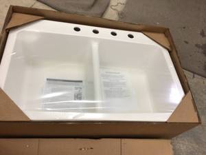 lot 64 image: Mont Blanc Bridgeport Dual Mount Composite Granite 33 in. 4-Hole Double Bowl Kitchen Sink in White Customer Returns See Pictures