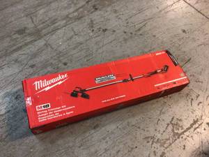lot 106 image: M18 18-Volt Lithium-Ion Brushless Cordless String Trimmer Kit with 6.0 Ah Battery and Charger by Milwaukee Customer Returns See Pictures