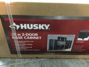 lot 114 image: Ready-to-Assemble 24-Gauge Steel 2-Door Garage Base Cabinet in Black (28 in. W x 32 in. H x 18 in. D) by Husky Customer Returns See Pictures