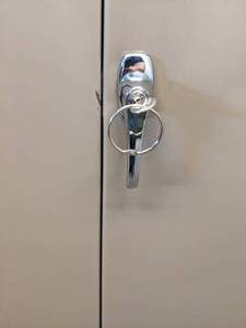 lot 1266 image: Tan Metal Locking Storage Cabinet