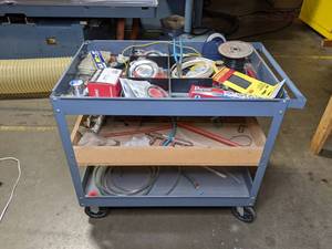 lot 434 image: Wheeled Cart with Contents - Spark Plug Boots, Electrical Tape, Shipping Tape, Heat Shrink Tubing, Wiring, and More