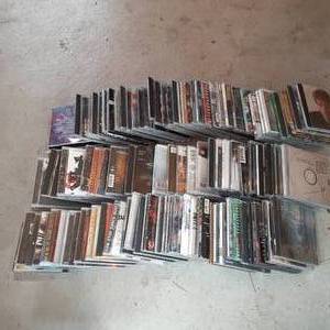 Box of CDs including Metallica, Gre...